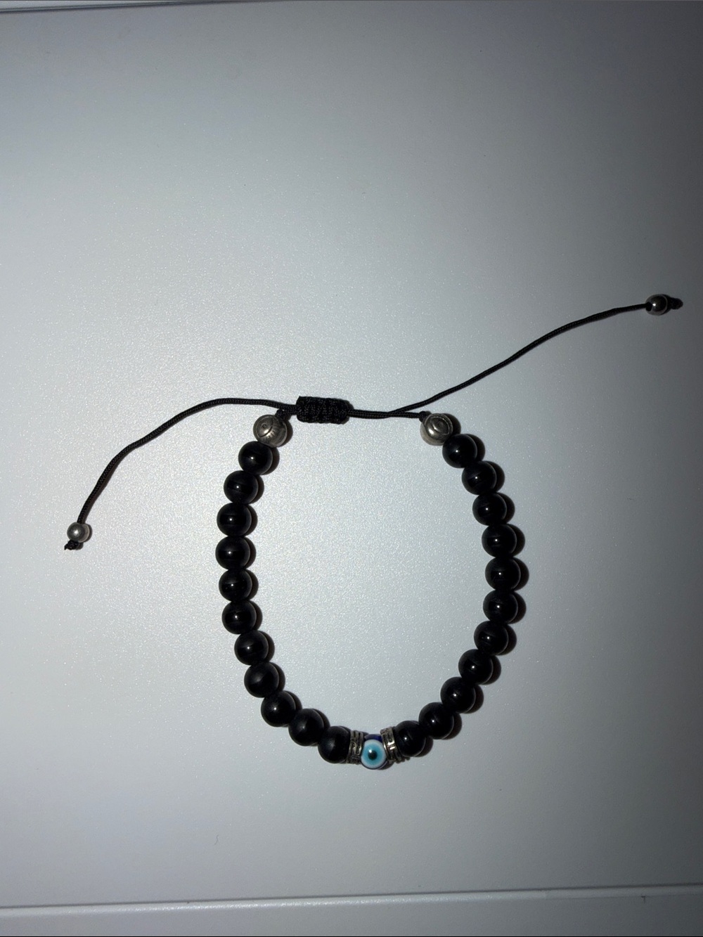Black Beaded Bracelet with Blue Eye Accent